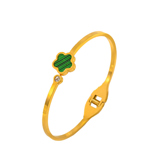 Gold bracelet with a green clover charm  Gold bracelet with a green clover charm