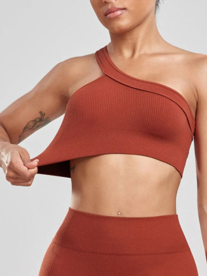 Women wearing one shoulder yoga top during workout