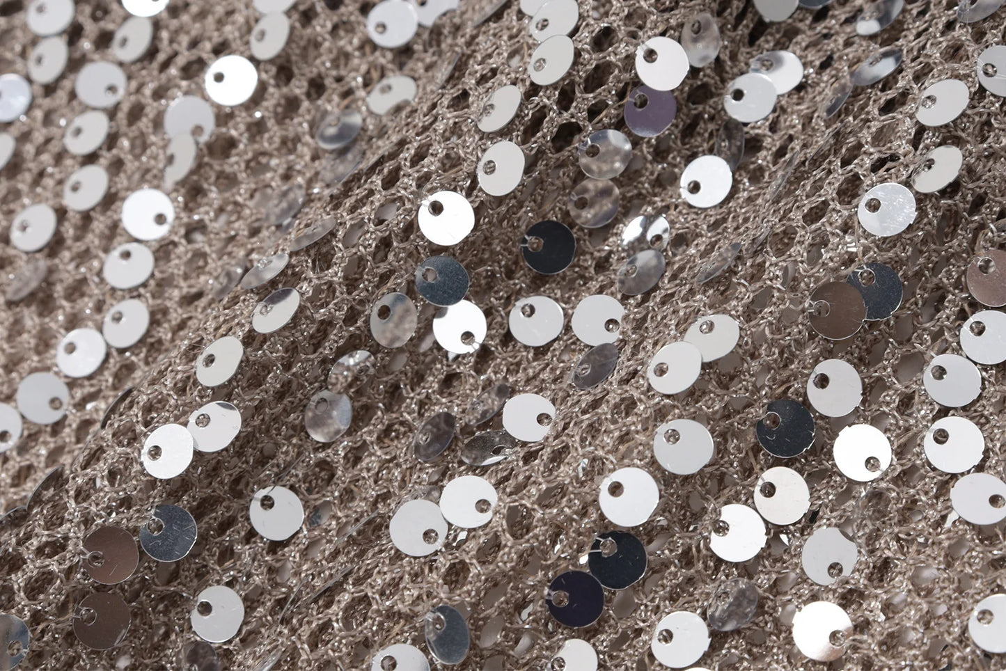 Close-up of sequined fabric with silver and black sequins