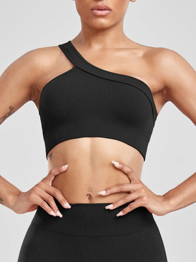 Women wearing one shoulder yoga top during workout