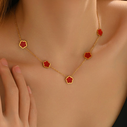 Gold necklace with red flower pendants Gold necklace with red flower pendants