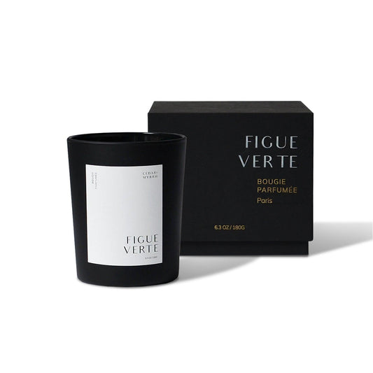 Black candle with 'Figue Verte' branding next to a matching black box  Black candle with 'Figue Verte' branding next to a matching black box