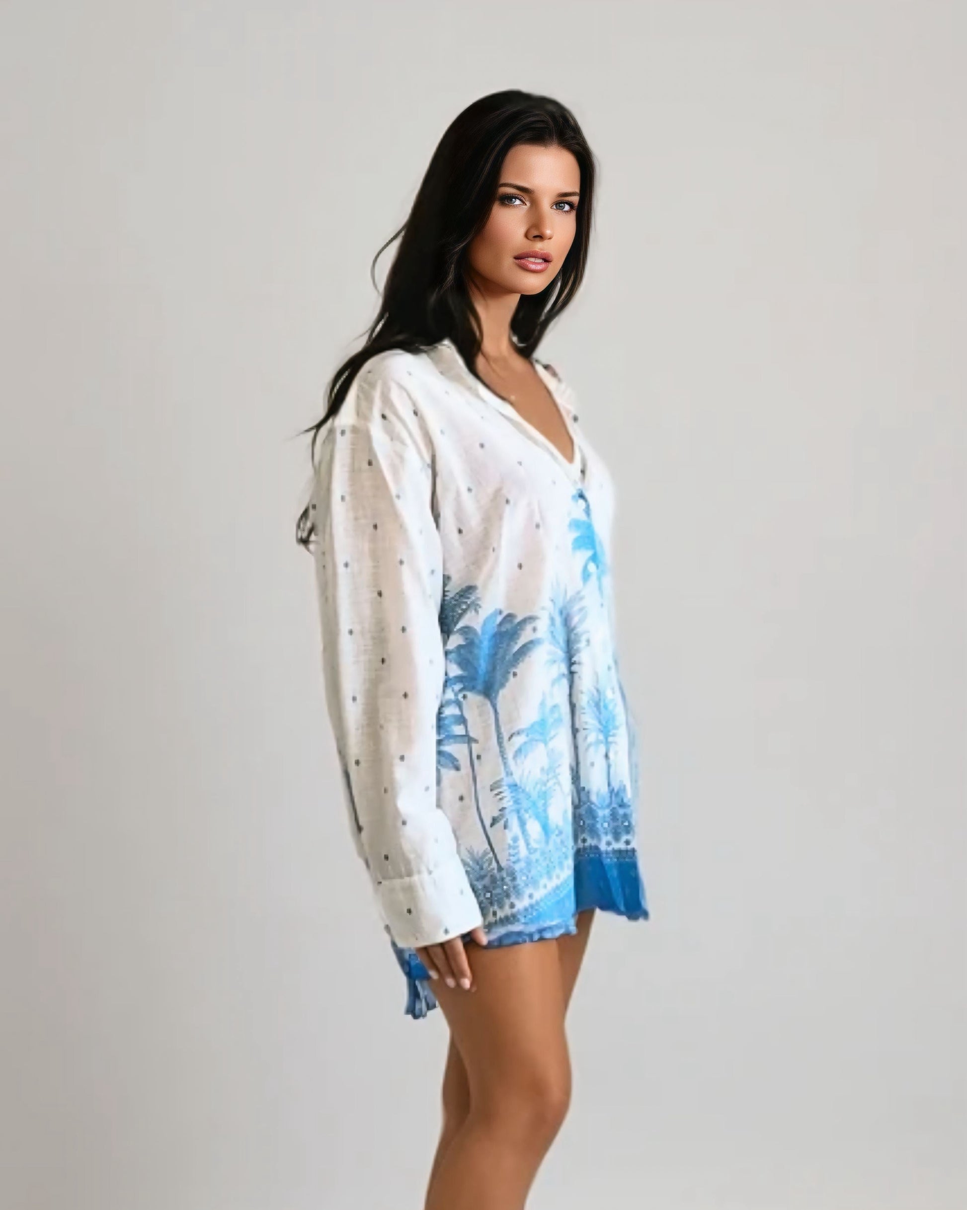 Woman wearing a white and blue floral shirt dress