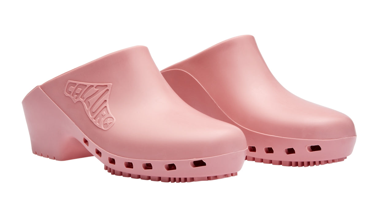 Pair of pink clogs with a visible brand logo