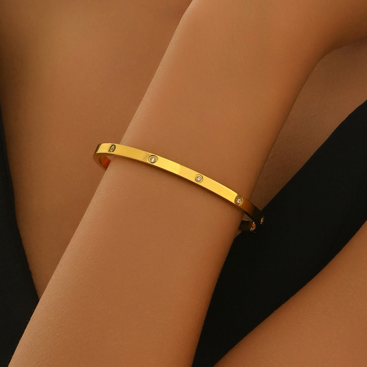 Gold bracelet on a woman wrist