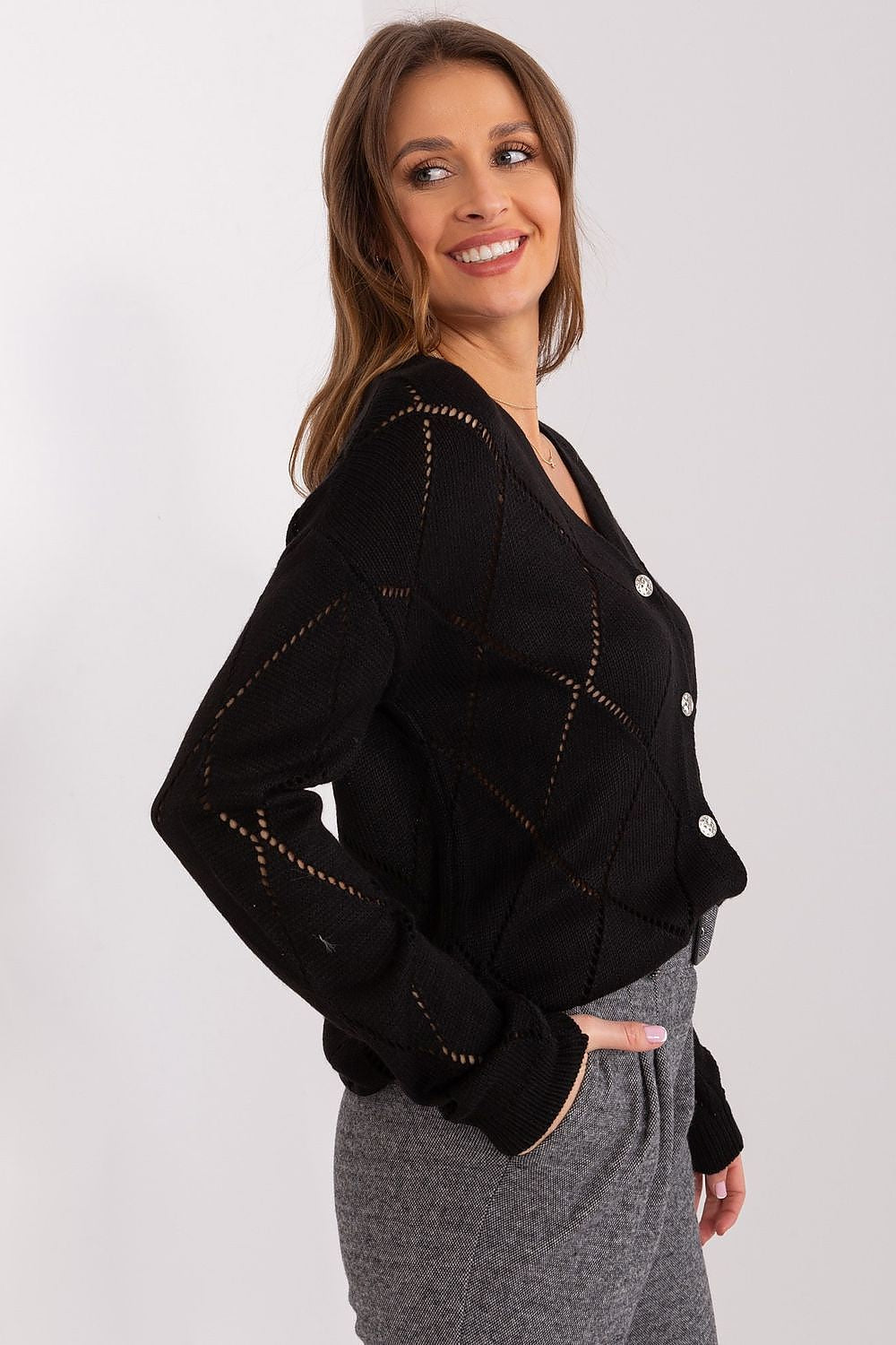 black cardigan with decorative buttons