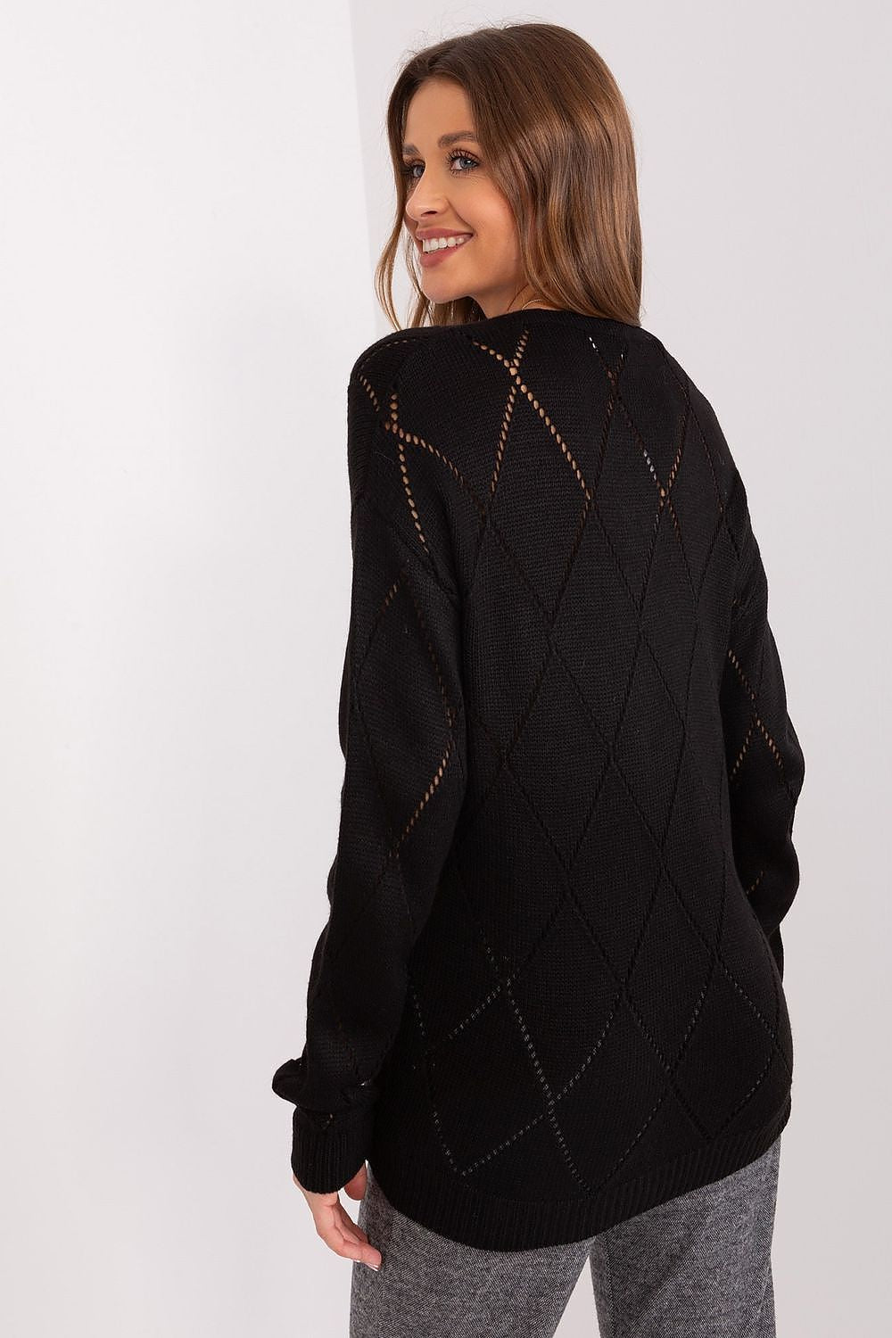 black  French sweater with intricate patterns