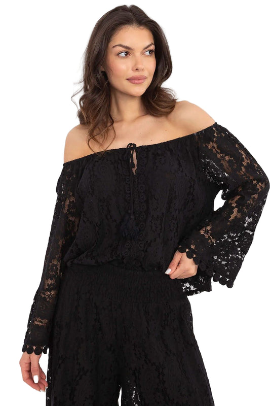 Woman wearing a black lace off-shoulder top  Woman wearing a black lace off-shoulder top