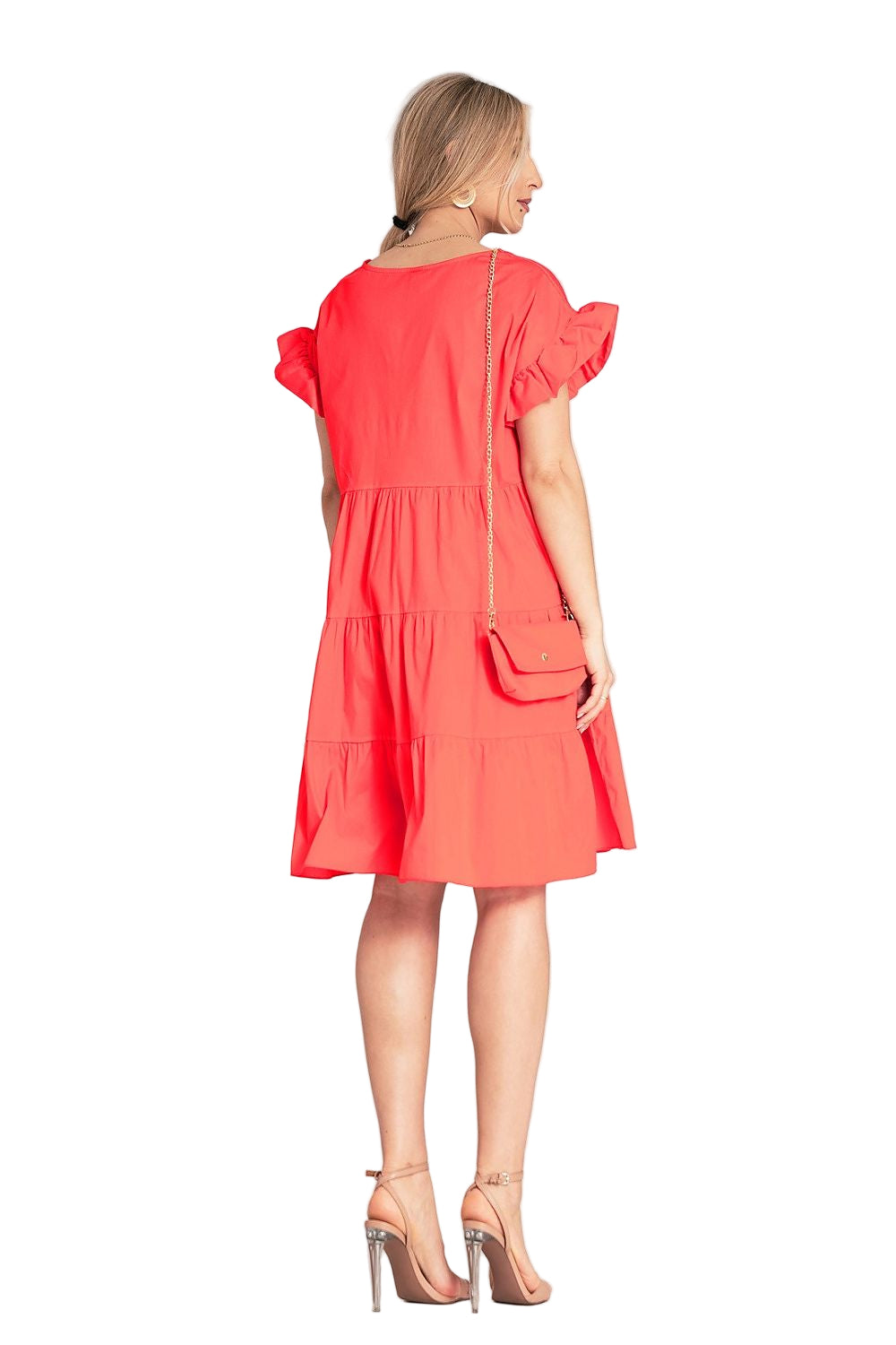 Model wearing cotton ruffle dress with chain bag - casual style