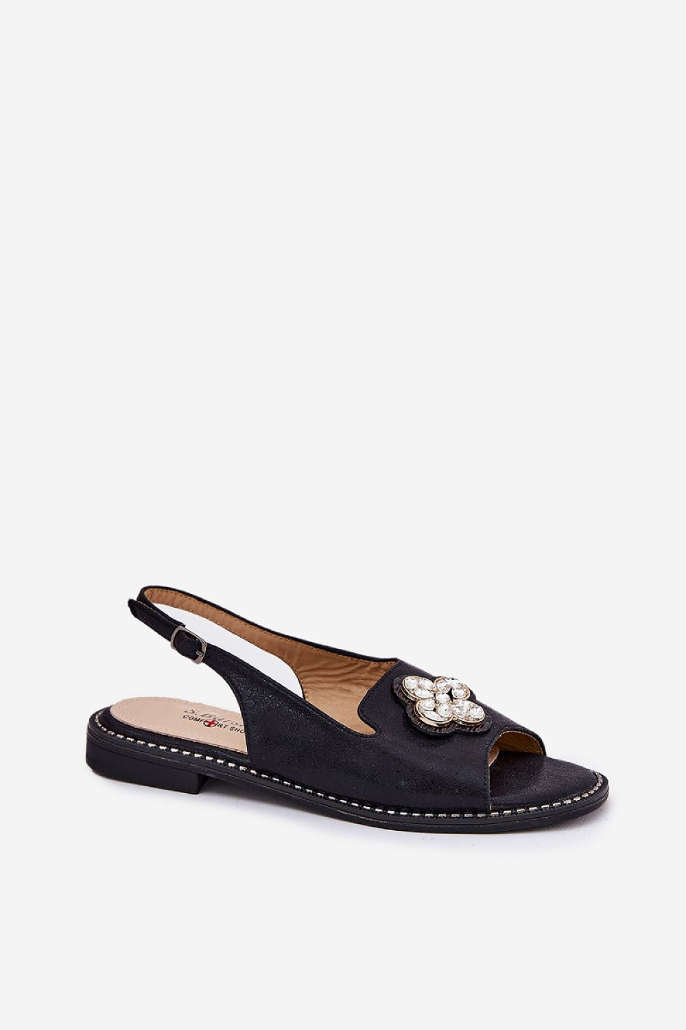 Black sandal with a decorative brooch