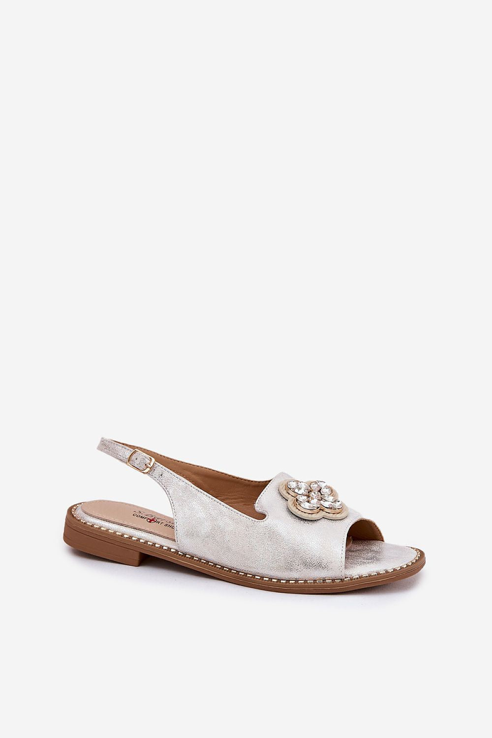 Casual eco-leather flat sandals styled with dress