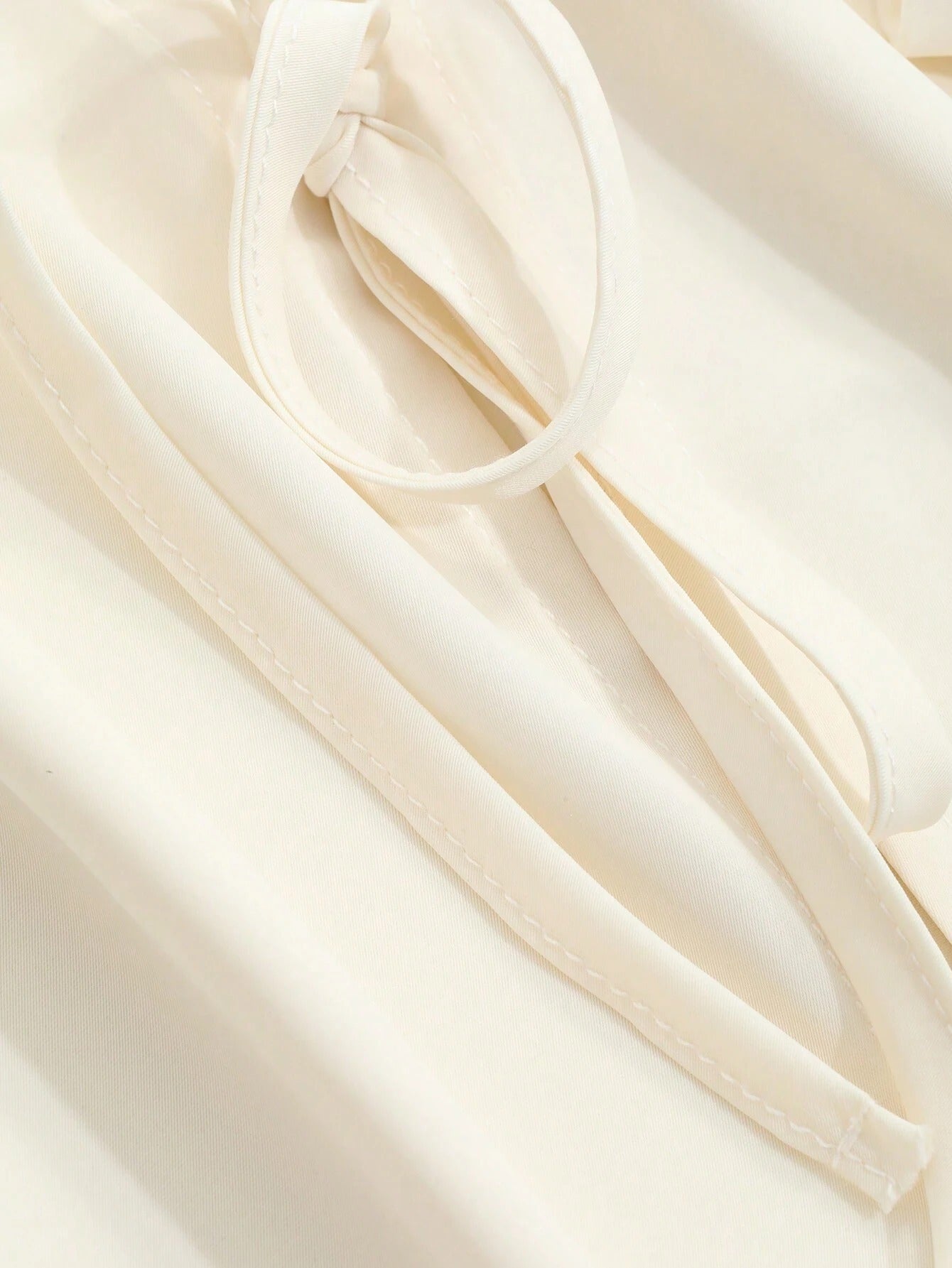 Close-up of beige fabric with a soft texture