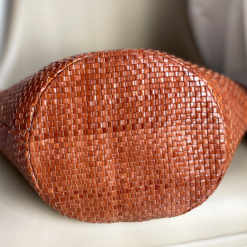Close-up of a brown woven handbag