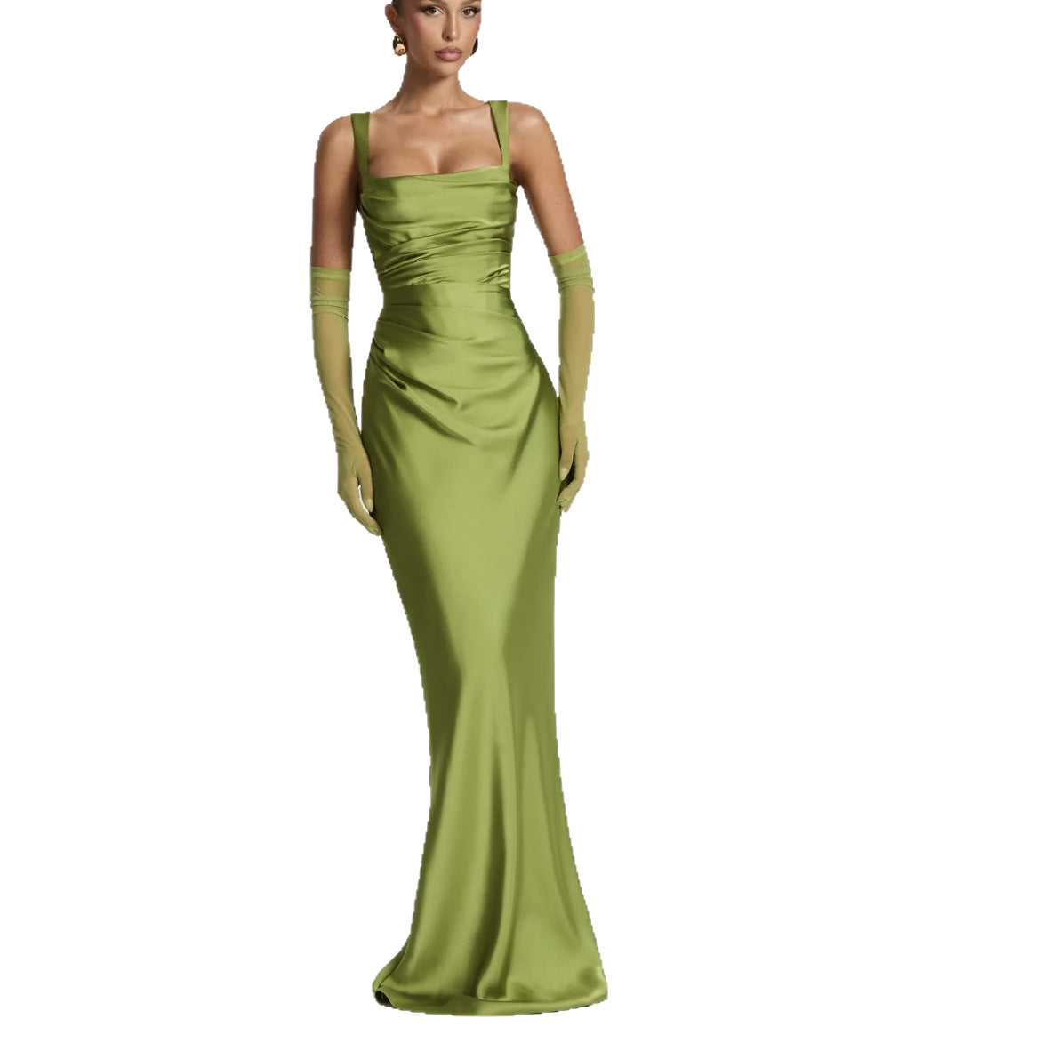 Woman wearing a green satin evening gown with matching gloves