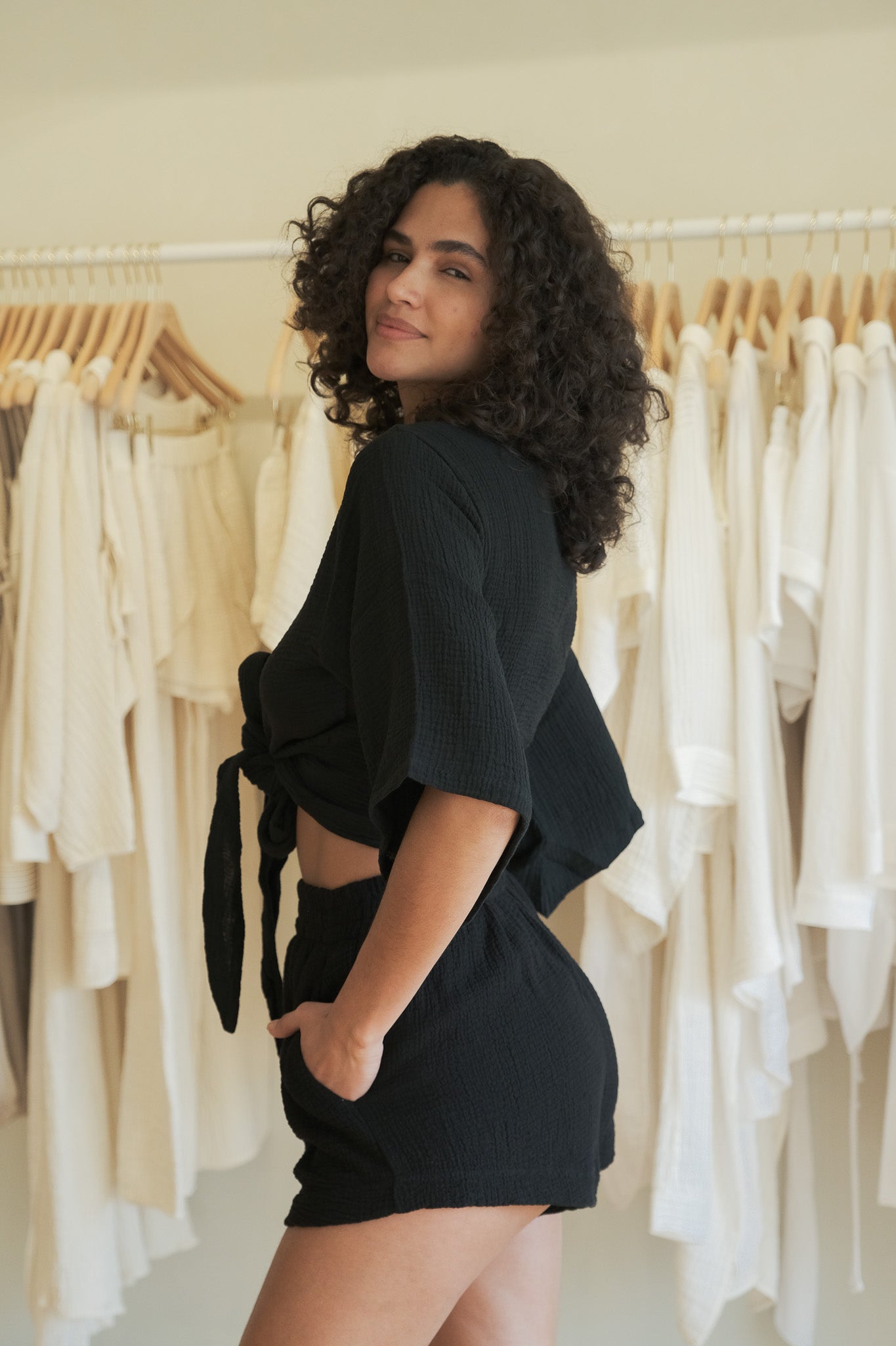 Back view of relaxed fit black shorts with high-rise elastic waist