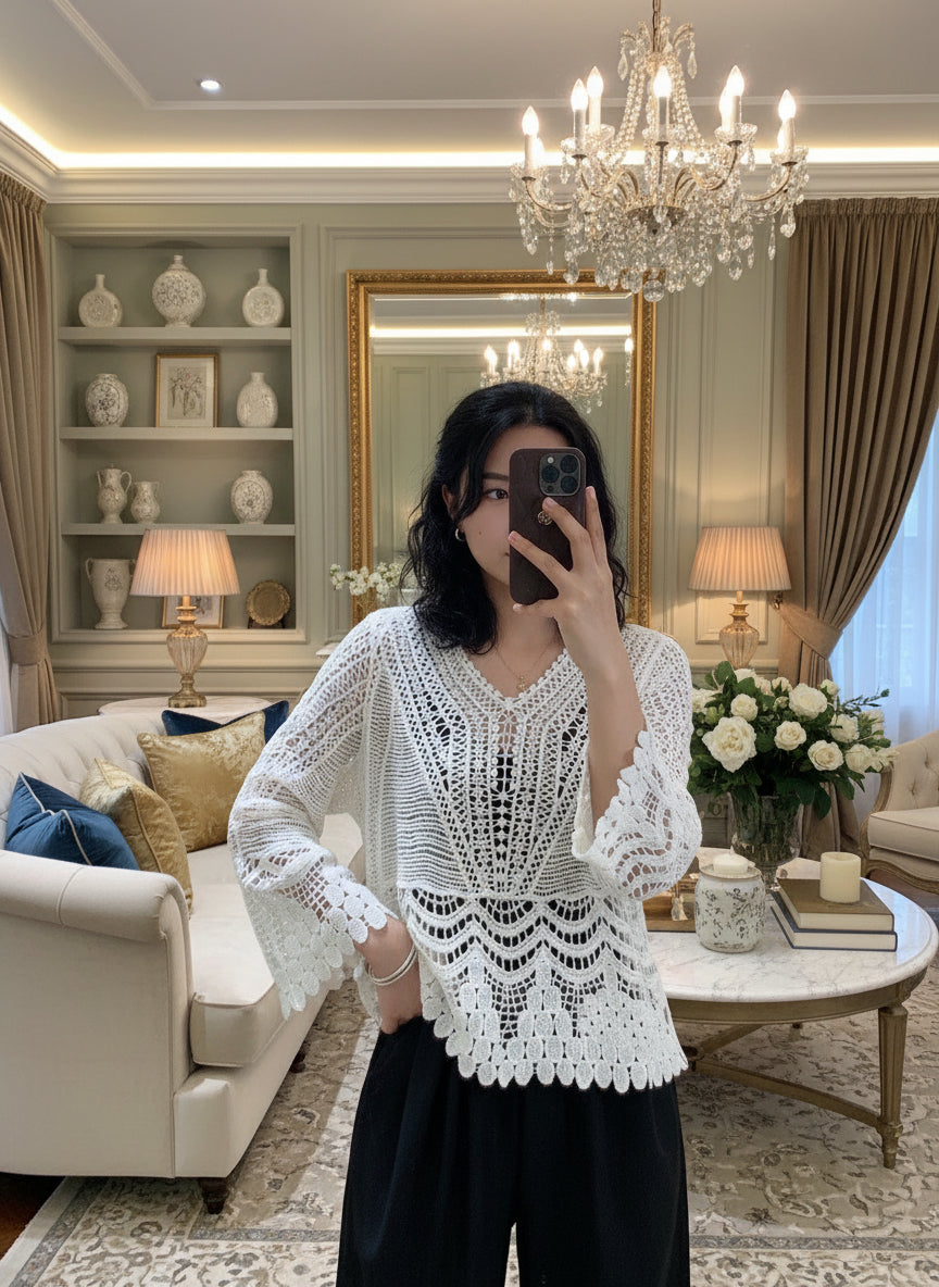 Person wearing a white crochet cover-up