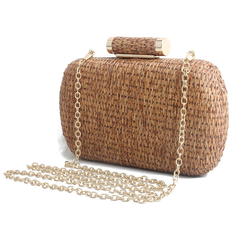 Brown woven clutch bag with a gold chain