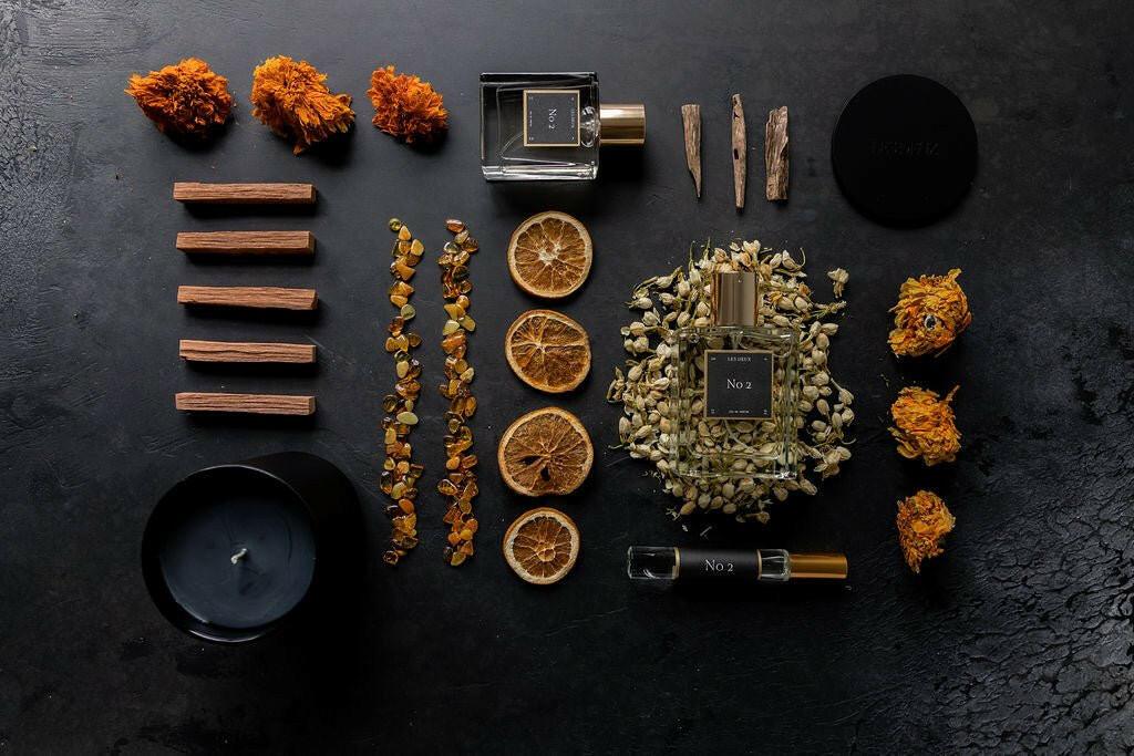 Collection of incense sticks, dried flowers, and a candle