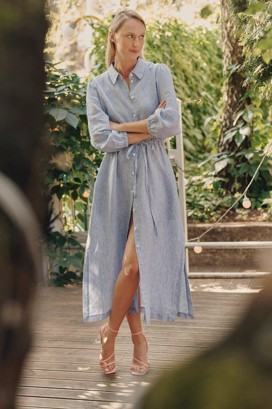 Elegant green linen shirt dress with side slits and waist belt.
 Elegant green linen shirt dress with side slits and waist belt.