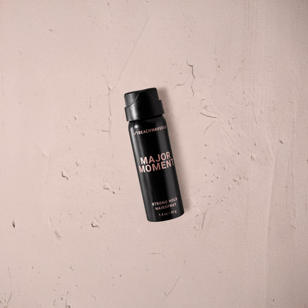 Black hair spray bottle labeled 'Major Moments'