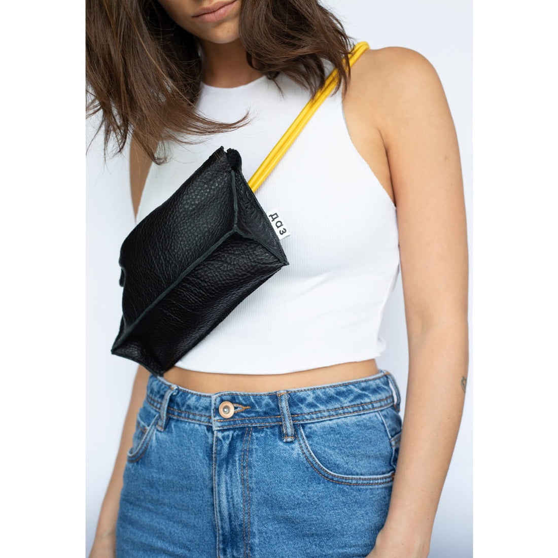 A lady carrying an Italian crossbody bag 