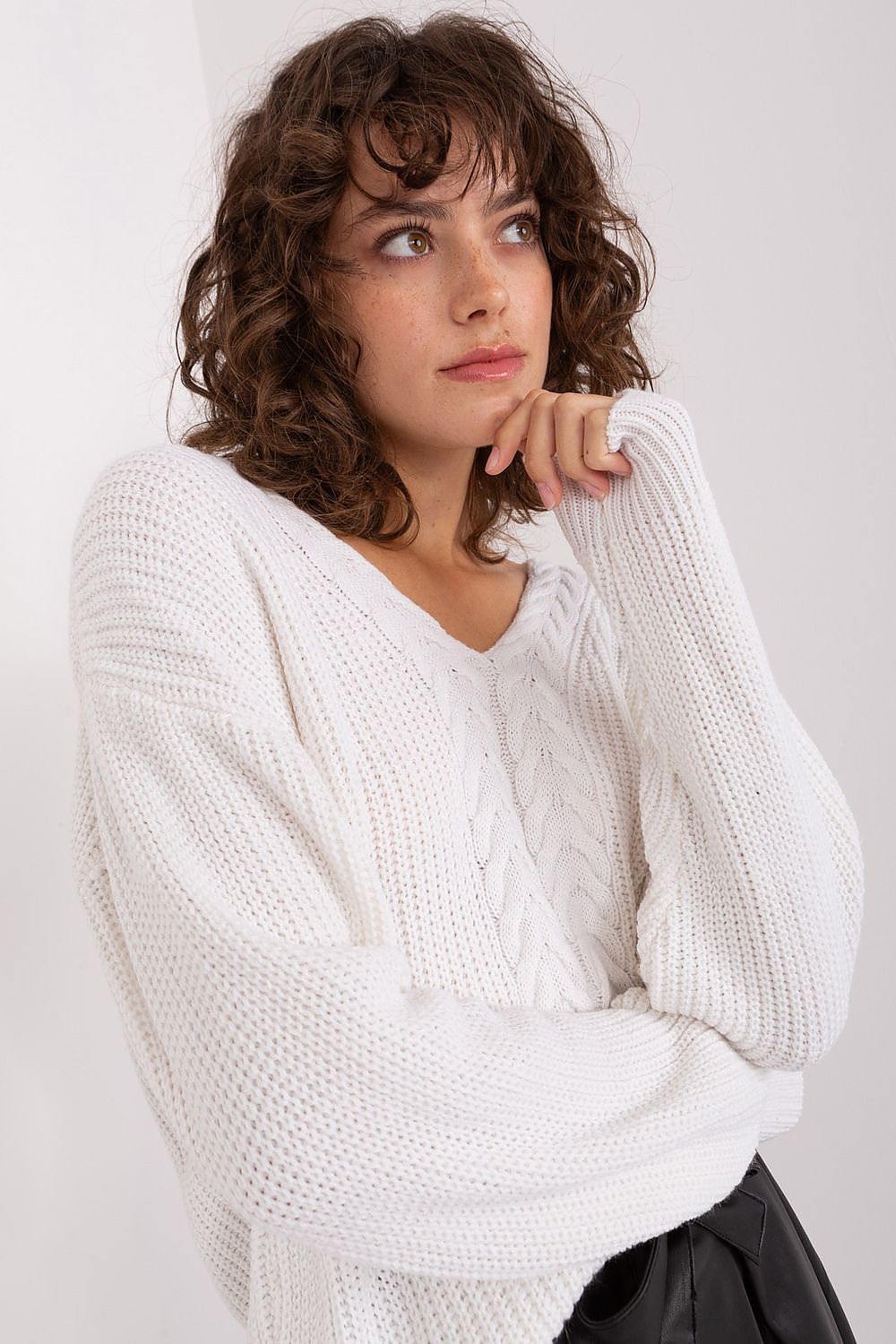 Woman wearing an european white sweater 