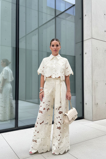 Person wearing a beige lace outfit  pants set 