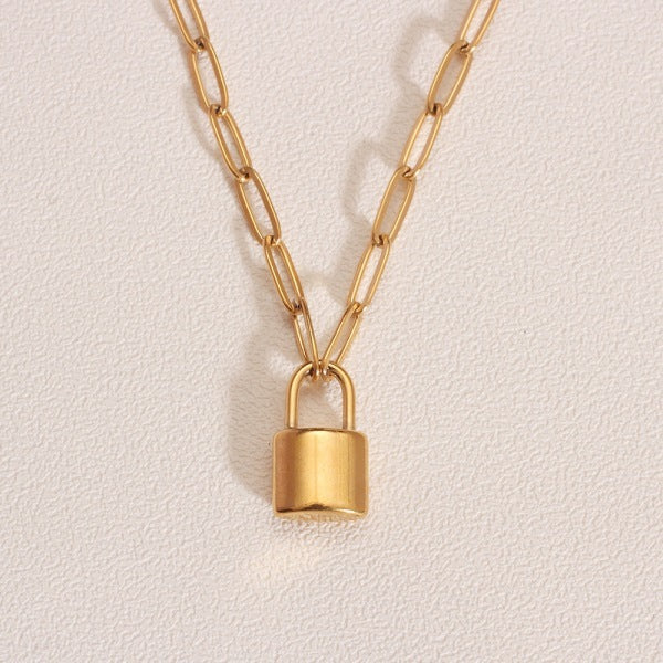 Gold chain necklace with a padlock pendant