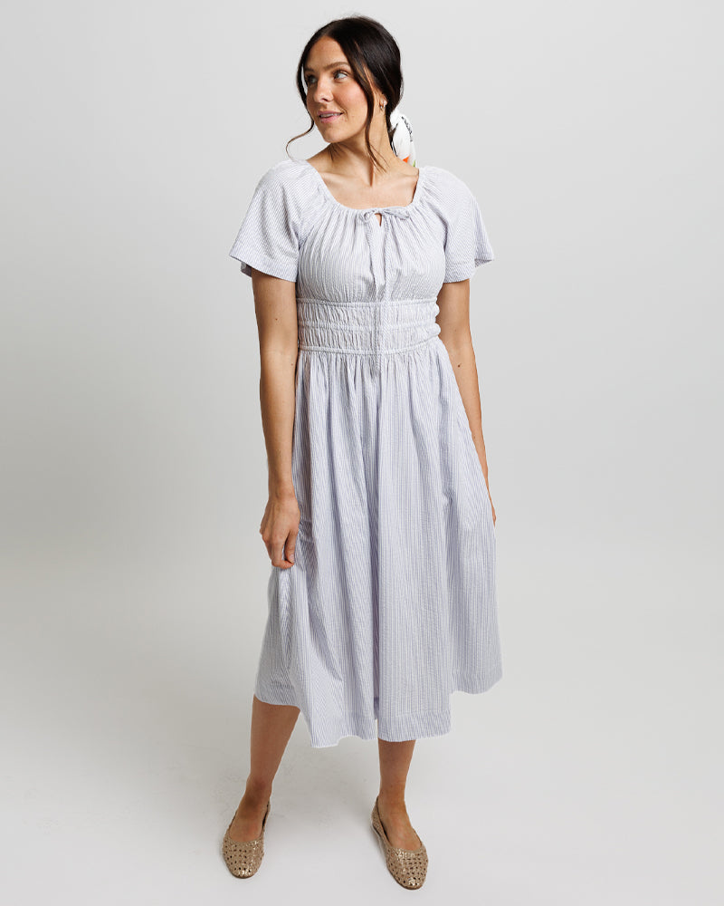 Woman modeling a light blue dress 