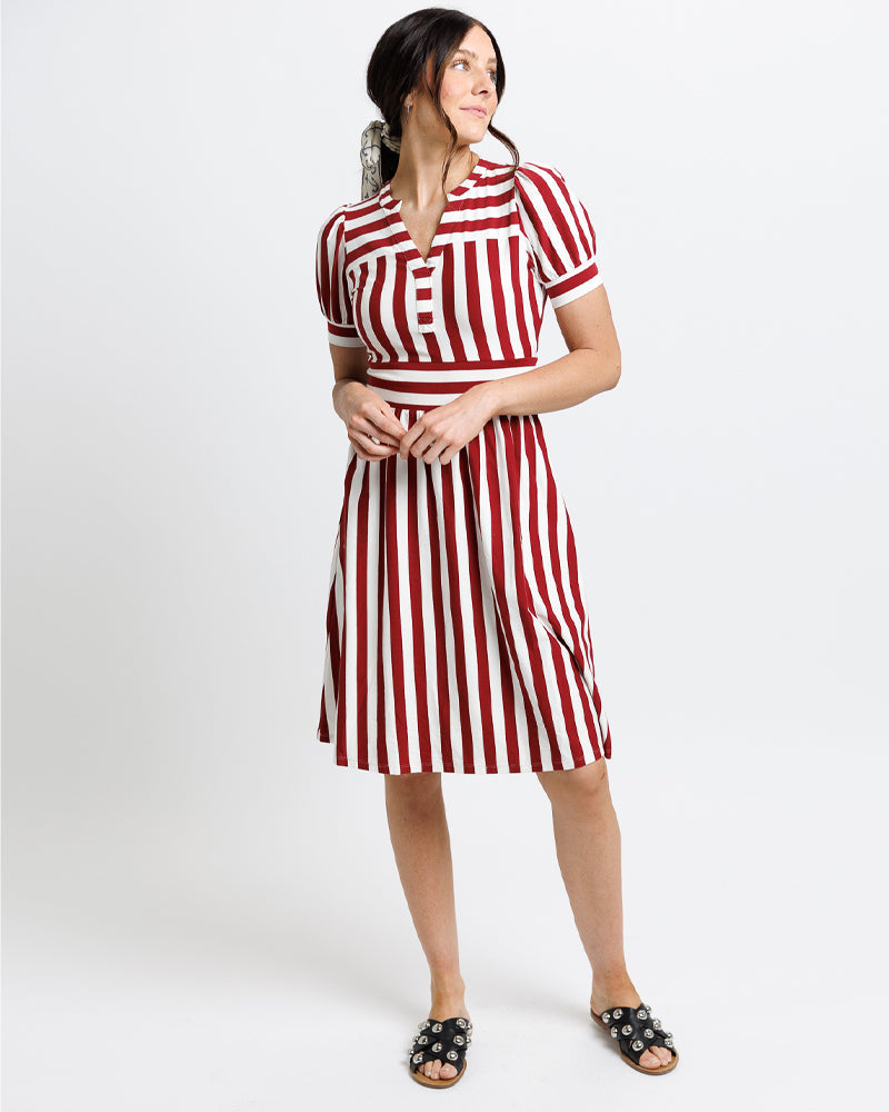 Woman wearing a red and white striped  midi dress 