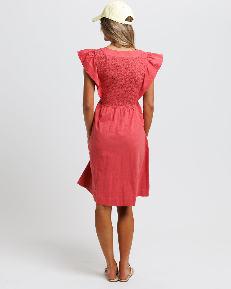 Woman wearing a  casual red dress with ruffled and short sleeves 