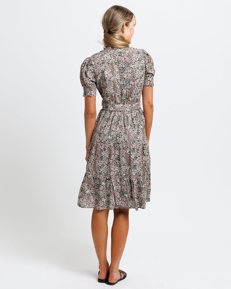 Woman wearing a casual floral dress 