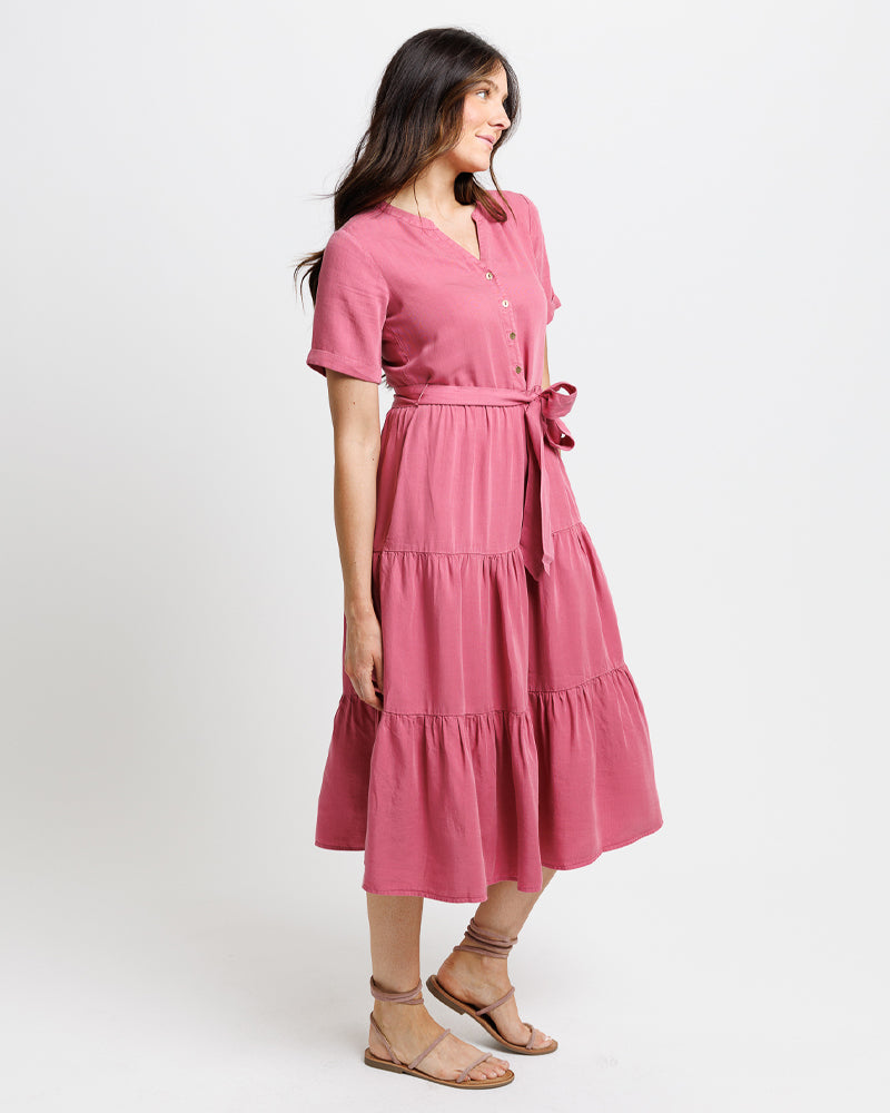 A lady showing off her beautiful all cotton pink dress