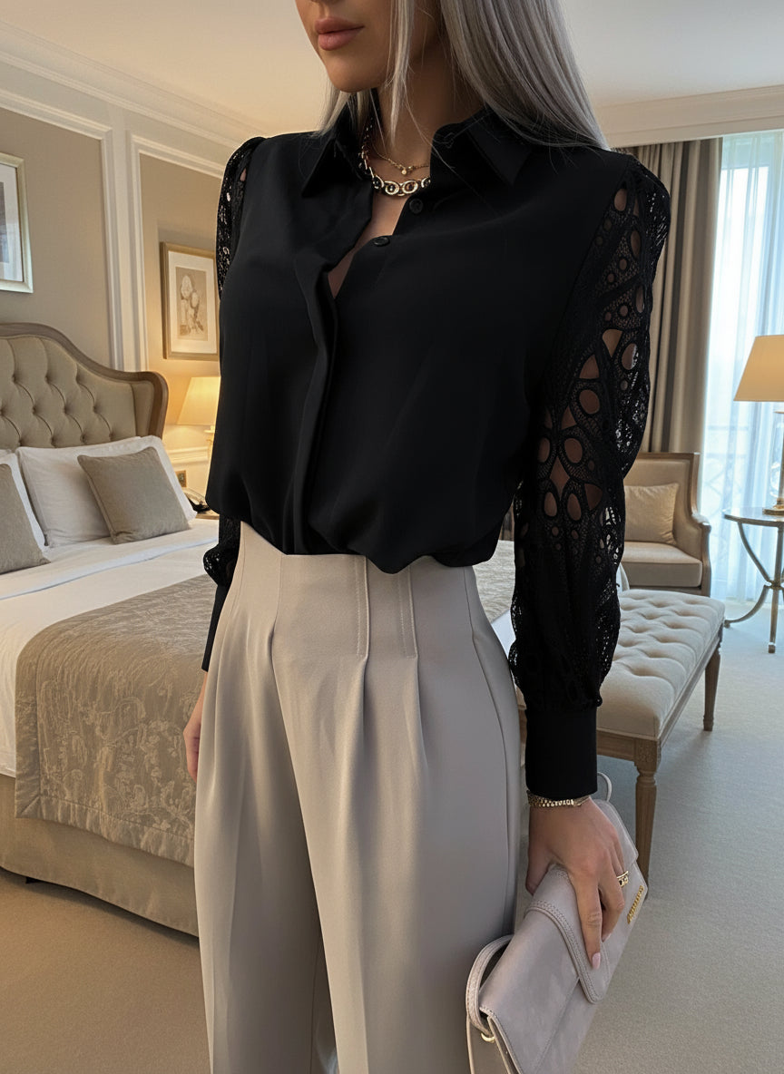 Black button-up blouse featuring collared neckline and lace sleeves
