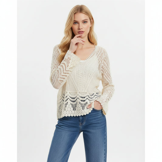 Woman wearing a cream lace top and blue jeans 