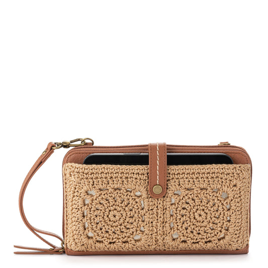 The Sak Iris Smartphone Wallet crossbody with crochet exterior and faux‑leather trim.