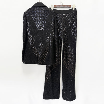 Back view of a black sequin lace blazer and matching wide-leg pants displayed on hangers.
