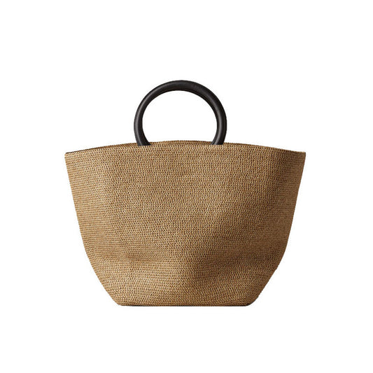 Brown woven bag with black handles 