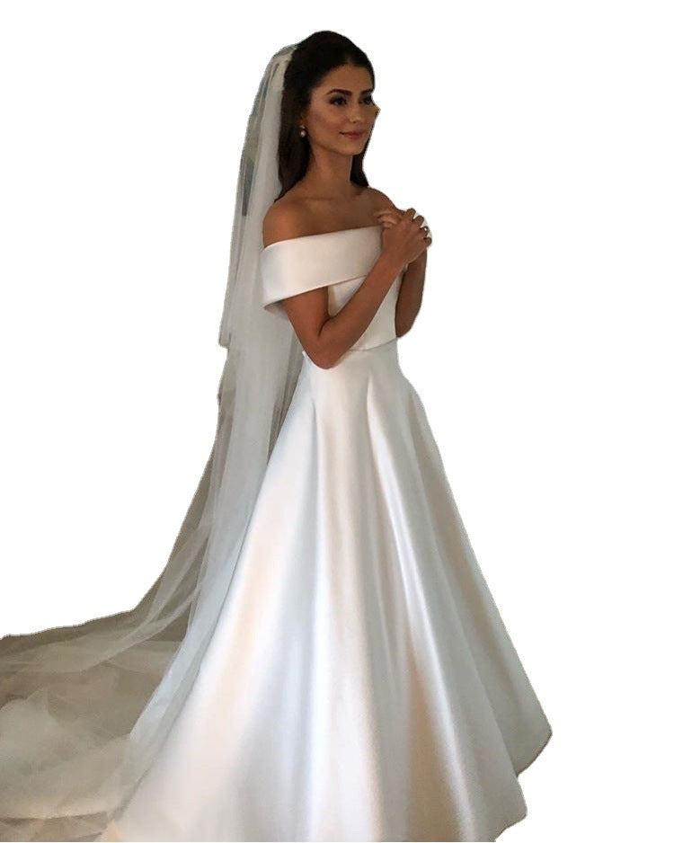 Woman wearing a white wedding dress with a veil 