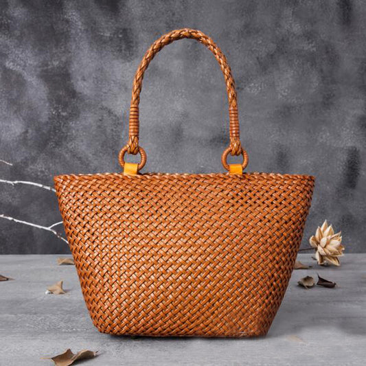 Brown woven handbag with braided handles 