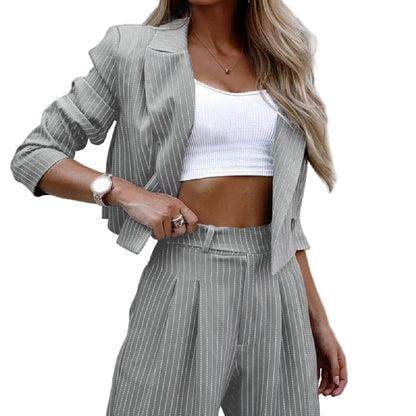 Women's gray pinstripe wide-leg trouser suit – side view showing floor-length straight leg and side pocket detail
