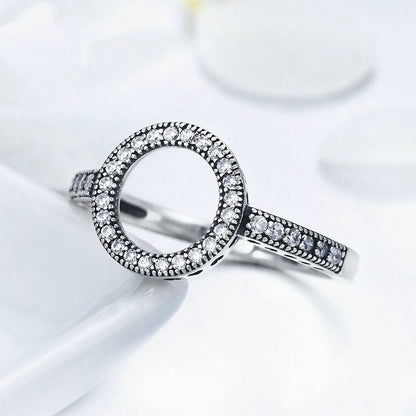 Close-up of minimalist silver promise ring on hand