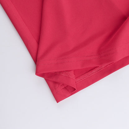 Close-up of a red fabric with visible stitching 