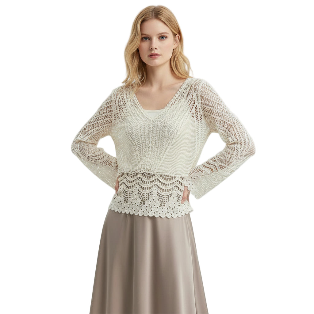 a blond girl wearing a white lace top and beige skirt 