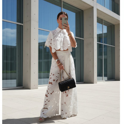 Person wearing a white lace outfit set