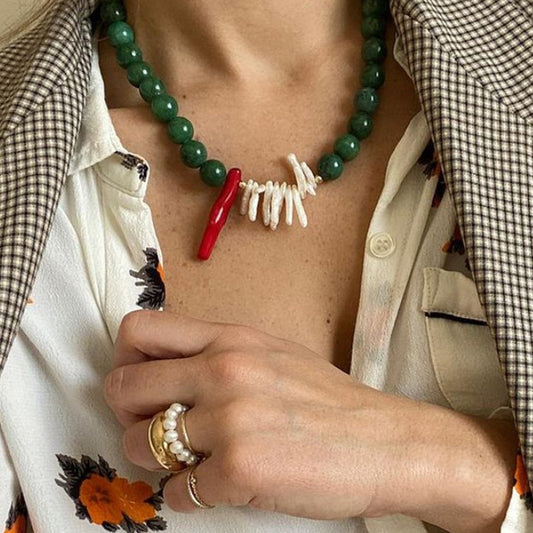 jade beaded necklace with a red and white pendant 