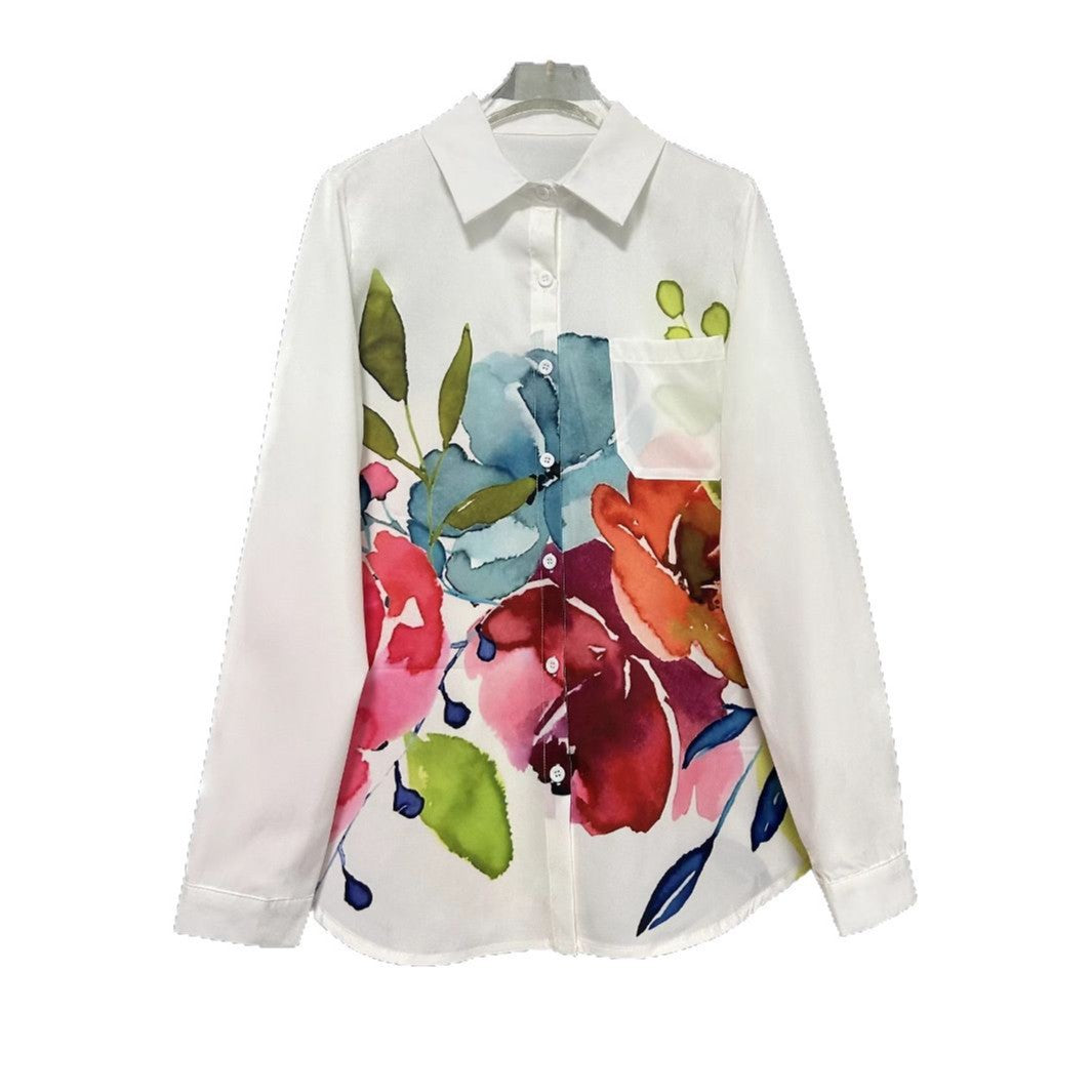 Women's white blouse featuring hand-painted style floral pattern with colorful blooms

