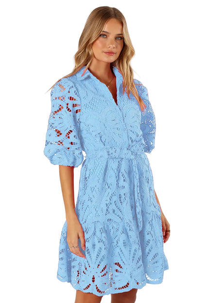 Woman wearing a light blue  mini lace dress 