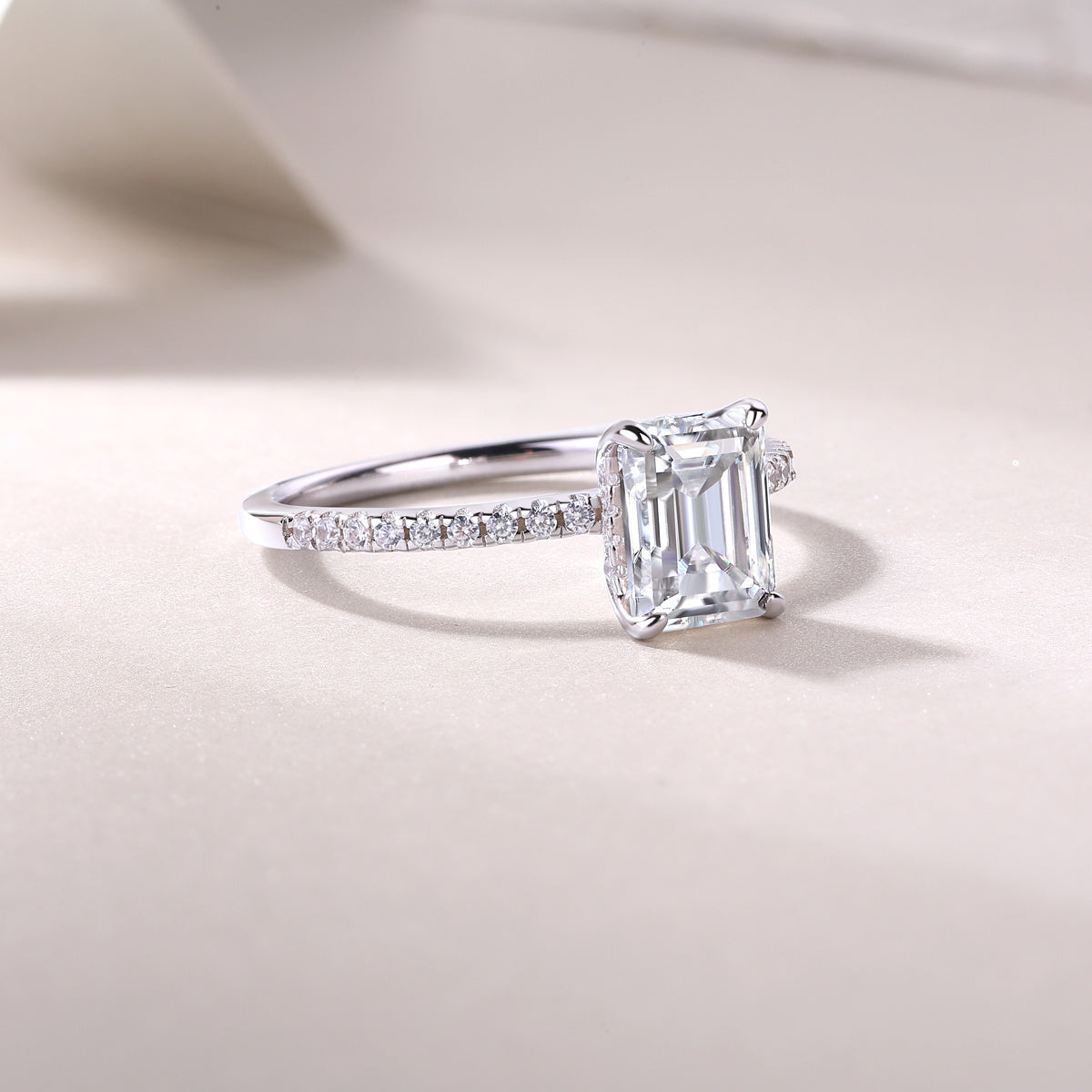 Diamond ring with emerald-cut center stone 