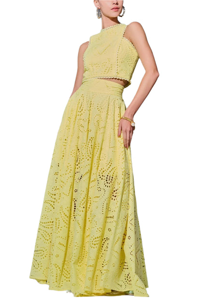 Woman wearing  a two pieces  yellow long skirt  outfit 